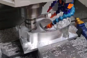 CNC lathe cutting a rotating metal workpiece